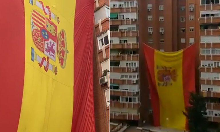 Un bloque de vecinos de Madrid cuelga una bandera de España gigante en su edificio