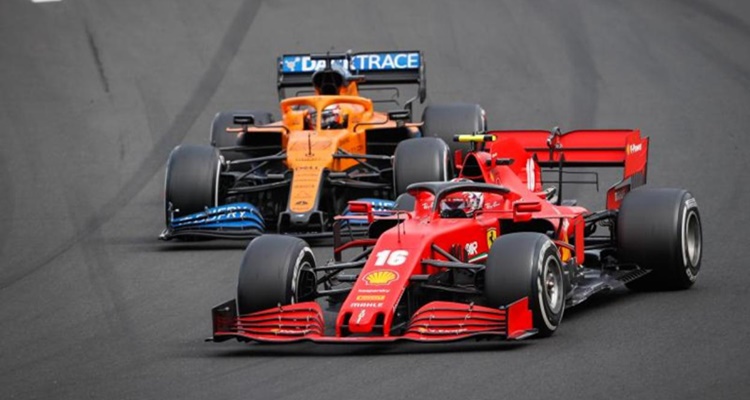 Carlos Sainz ganar Leclerc Ferrari