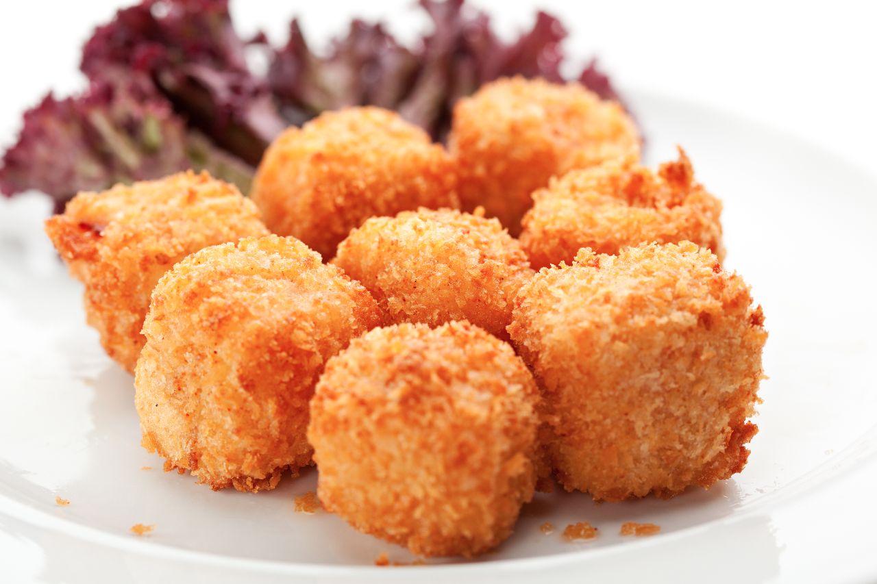 Cómo hacer cuadraditos de jamón york y queso Babybel empanados