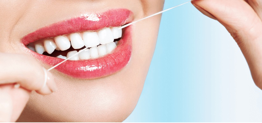 Usar hilo dental de forma correcta