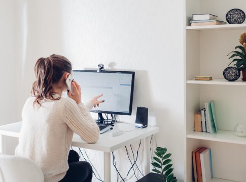 Work from home during coromavirus pandemic. Woman stays home. Workspace of freelancer. Office interior with computer