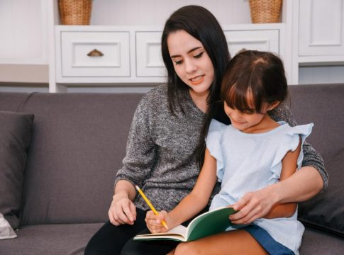 mother-and-daughter-spending-time-together-in-living-room-mother-teaching-her-daughter-homeschooling-reading-book-study-at-home-1024x683.jpg