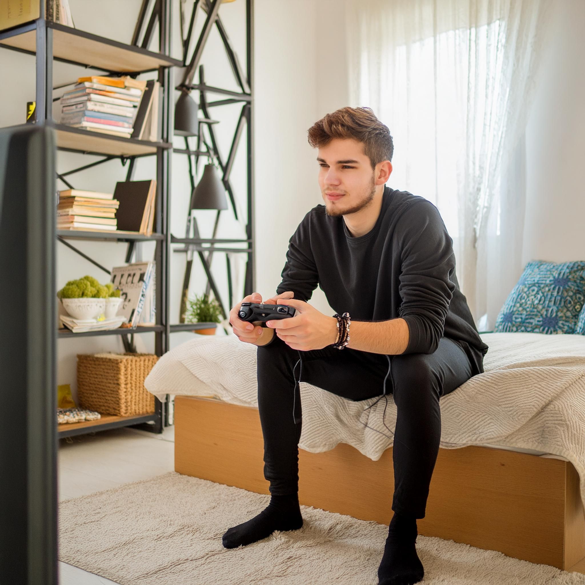 El fisioterapeuta Pablo de la Serna analiza la relación entre videojuegos y dolor de espalda 1 Joven consola Laura Soriano IA Firefly 1