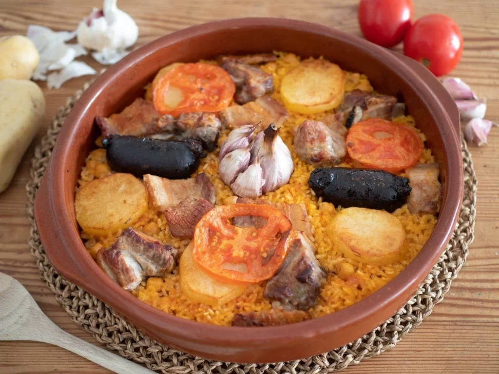 Cómo preparar el verdadero arroz al horno: el plato tradicional con costillas, morcilla y patatas 36 Cocción final en el horno