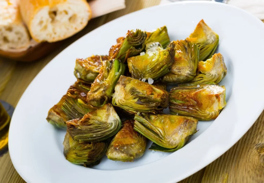 Aprende a preparar unas deliciosas alcachofas al horno con especias 49 Horneado y presentación final