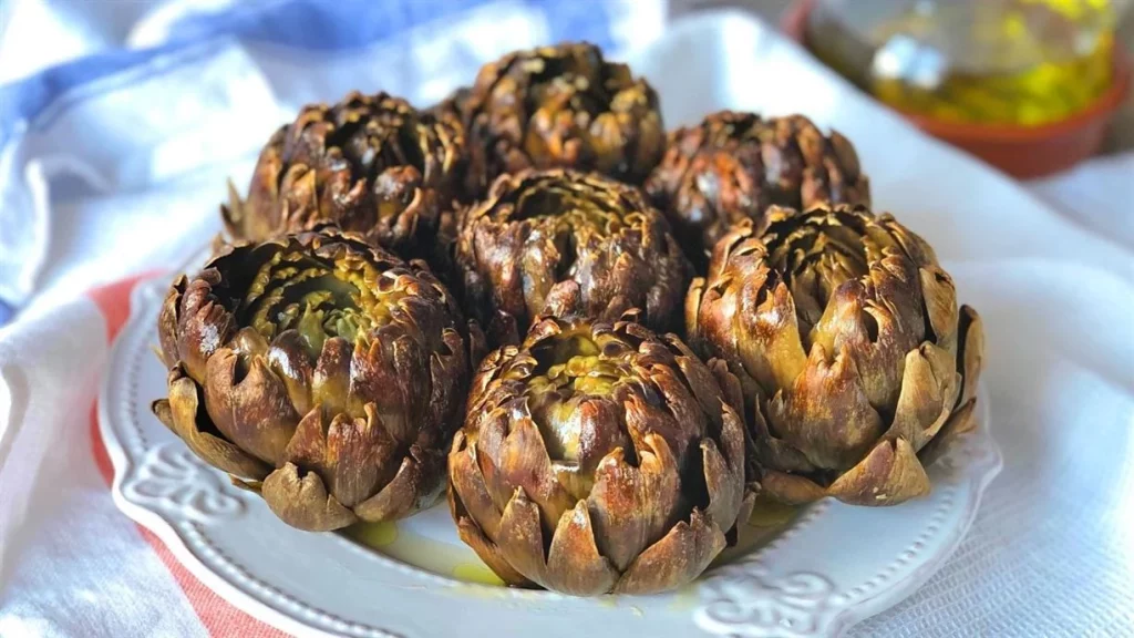 Aprende a preparar unas deliciosas alcachofas al horno con especias 47 Preparación previa: limpieza y corte de las alcachofas