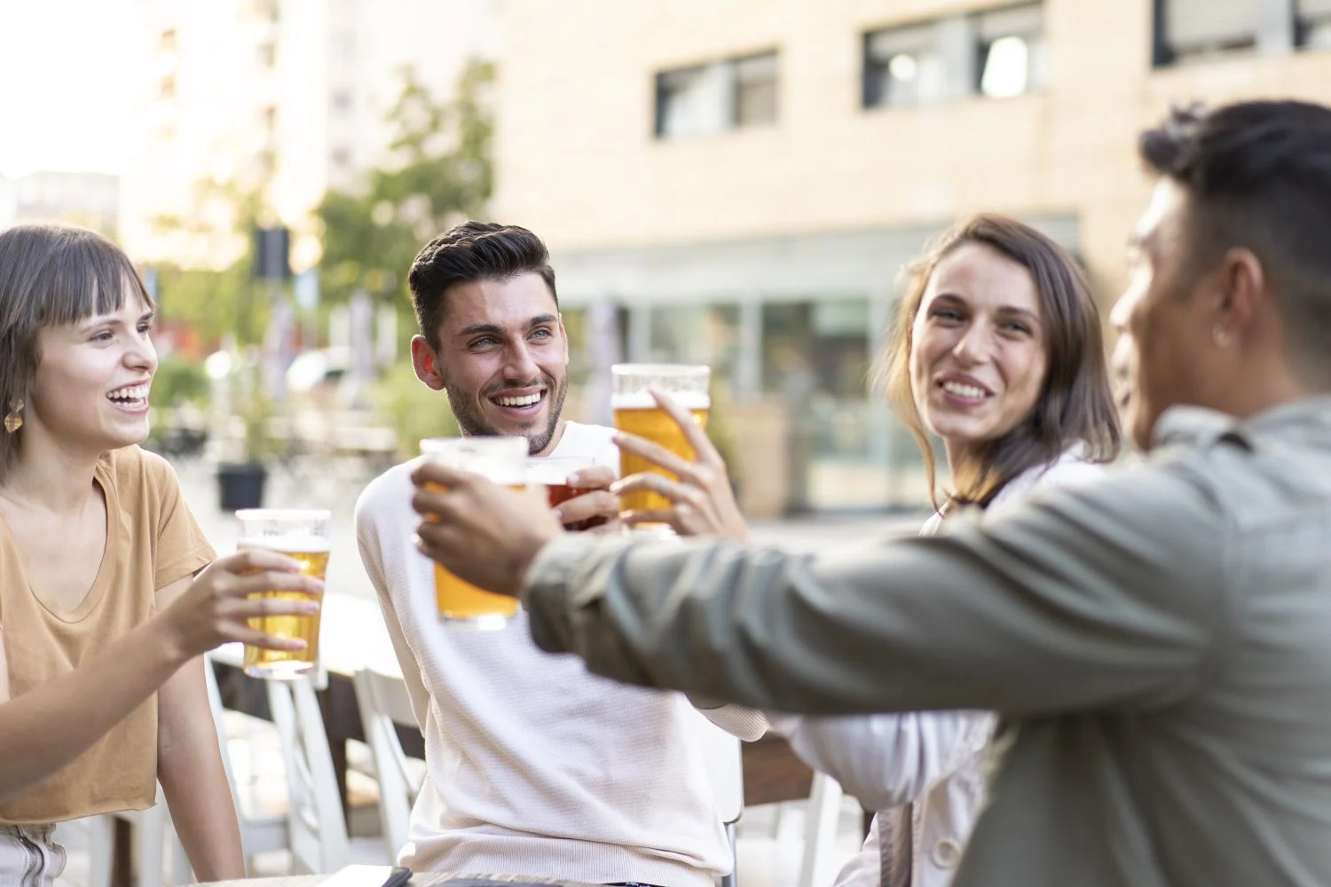 multiracial friends drinking beer brewery pub garden genuine friendship life style concept with guys girls enjoying happy hour food together open air bar dehor warm vivid filter
