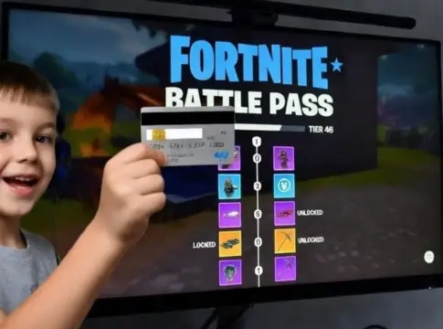 Ludopatía en menores pase de batalla Fortnite PEGI Representación de un niño con una tarjeta bancaria mientras juega a Fortnite