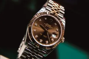 silver and gold round analog watch at 10 10