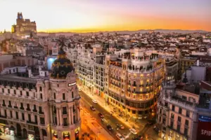 An aerial view of the Metropolis building and Gran Via in Madrid at low sun